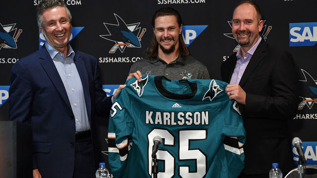 SAN JOSE, CA - SEPTEMBER 19: (L-R) General Manager Doug Wilson, Erik Karlsson, and head coach Peter DeBoer of the San Jose Sharks pose for a photo during a press conference at the Hilton on September 19, 2018 in San Jose, California