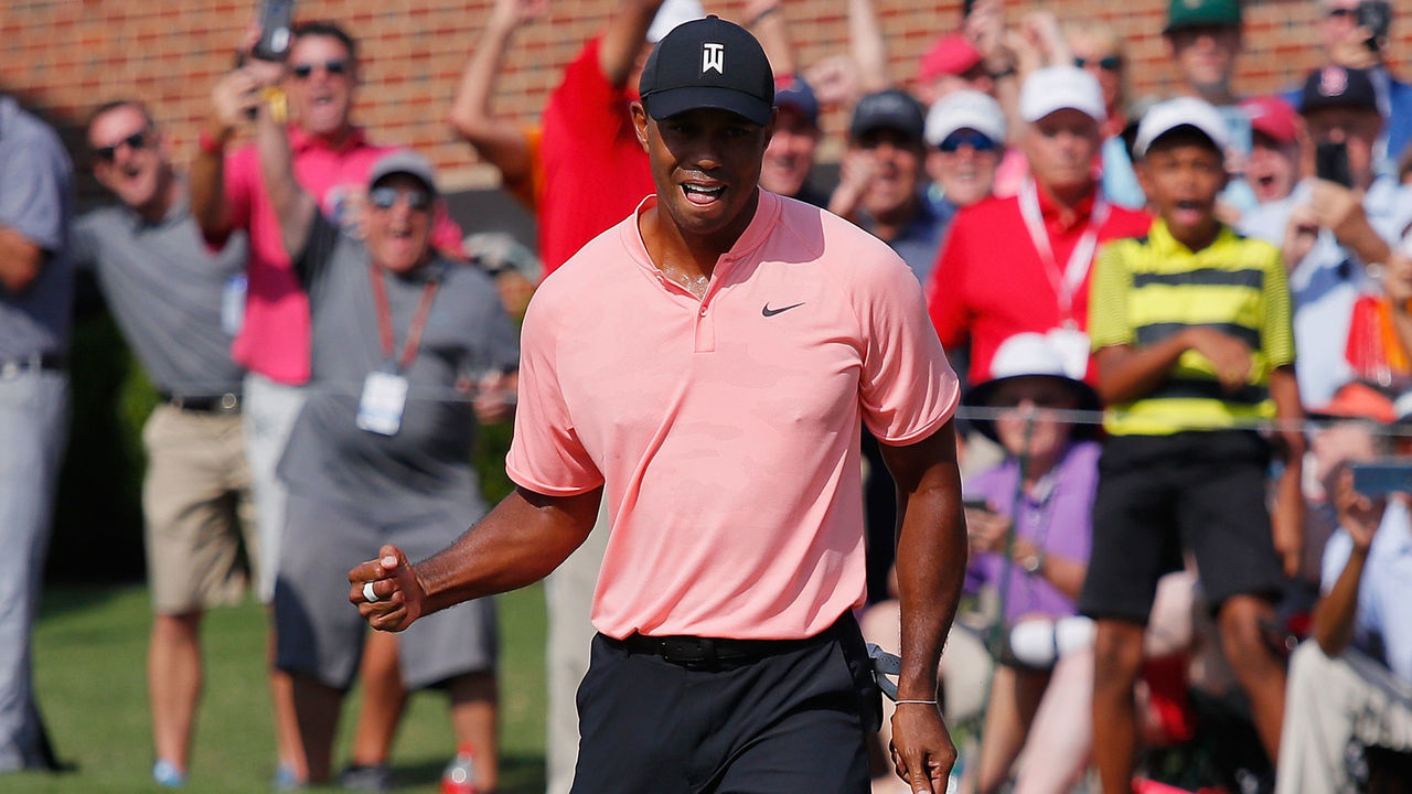ATLANTA, GA - SEPTEMBER 20: Tiger Woods of the United States reacts after making a putt for eagle on the 18th green during the first round of the TOUR Championship at East Lake Golf Club on September 20, 2018 in Atlanta, Georgia.