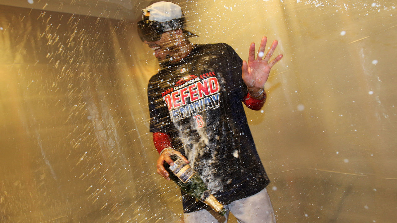 NEW YORK, NY - SEPTEMBER 20: Mookie Betts #50 celebrates in the visitor's clubhouse after the Red Sox defeated the Yankees, 11-6, to clinch the AL East division title at Yankee Stadium on Thursday, September 20, 2018 in the Bronx borough of New York City.