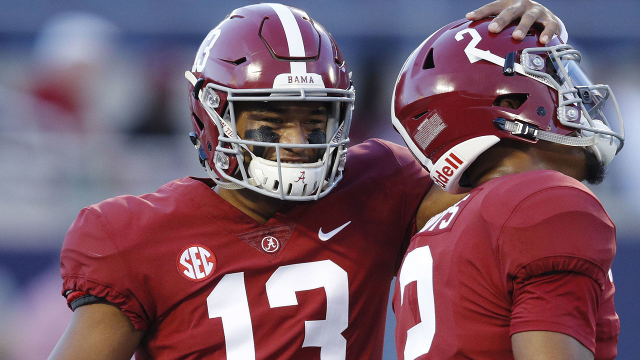ORLANDO, FL - SEPTEMBER 01: Tua Tagovailoa #13 and Jalen Hurts #2 of the Alabama Crimson Tide talk prior to the game against the Louisville Cardinals at Camping World Stadium on September 1, 2018 in Orlando, Florida.