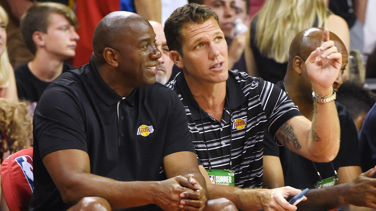 LAS VEGAS, NV - JULY 07: Los Angeles Lakers president of basketball operations Earvin 'Magic' Johnson (L) and head coach Luke Walton of the Lakers talk during a 2017 Summer League game between the Lakers and the Los Angeles Clippers at the Thomas & Mack Center on July 7, 2017 in Las Vegas, Nevada. The Clippers won 96-93 in overtime.