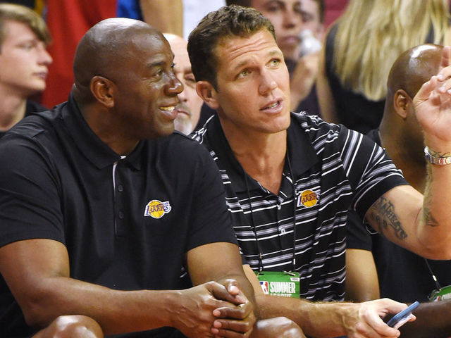 LAS VEGAS, NV - JULY 07: Los Angeles Lakers president of basketball operations Earvin 'Magic' Johnson (L) and head coach Luke Walton of the Lakers talk during a 2017 Summer League game between the Lakers and the Los Angeles Clippers at the Thomas & Mack Center on July 7, 2017 in Las Vegas, Nevada. The Clippers won 96-93 in overtime.