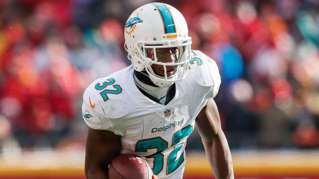 KANSAS CITY, MO - DECEMBER 24: Running back Kenyan Drake #32 of the Miami Dolphins runs by the pursuit of defensive back Darrelle Revis #24 of the Kansas City Chiefs during the second quarter of the game at Arrowhead Stadium on December 24, 2017 in Kansas City, Missouri. ( Photo by Jamie Squire/Getty Images )