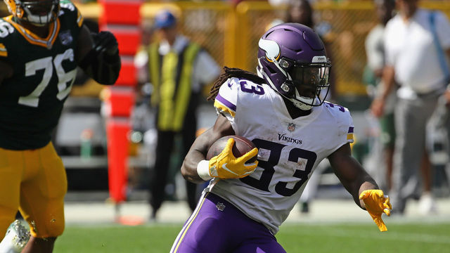 GREEN BAY, WI - SEPTEMBER 16: Dalvin Cook #33 of the Minnesota Vikings runs against the Green Bay Packers at Lambeau Field on September 16, 2018 in Green Bay, Wisconsin. The Vikings and the Packers tied 29-29 after overtime.