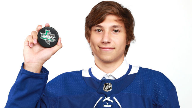 DALLAS, TX - JUNE 23: Semyon Der-Arguchintsev poses after being selected 76th overall by the Toronto Maple Leafs during the 2018 NHL Draft at American Airlines Center on June 23, 2018 in Dallas, Texas.