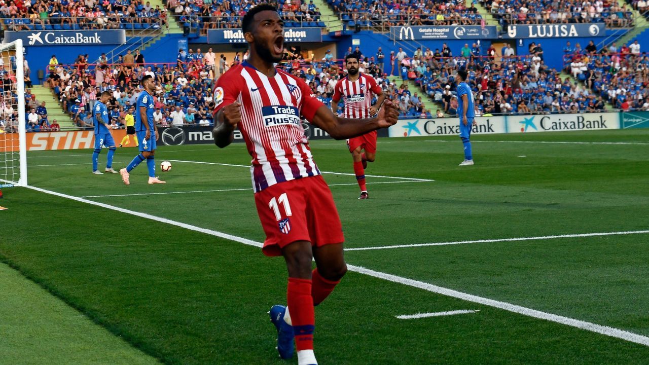 Atletico Madrid's French midfielder Thomas Lemar celebrates after scoring a goal during the Spanish league football match between Getafe CF and Club Atletico de Madrid at the Col. Alfonso Perez stadium in Getafe on September 22, 2018.