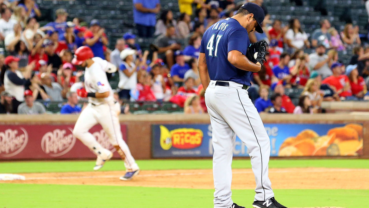 ARLINGTON, TX - SEPTEMBER 21: James Pazos #47 of the Seattle Mariners stands on the mound as Joey Gallo #13 of the Texas Rangers runs the bases after a solo home run in the sixth inning at Globe Life Park in Arlington on September 21, 2018 in Arlington, Texas.