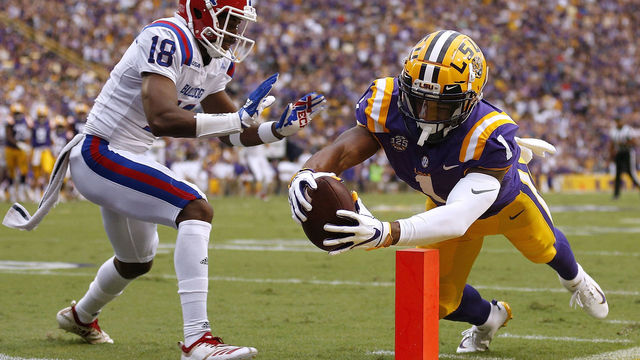 BATON ROUGE, LA - SEPTEMBER 22: Ja'Marr Chase #1 of the LSU Tigers dives for a touchdown as Zach Hannibal #18 of the Louisiana Tech Bulldogs defend during the first half at Tiger Stadium on September 22, 2018 in Baton Rouge, Louisiana. Chase was later ruled out of bound before crossing the goal line.