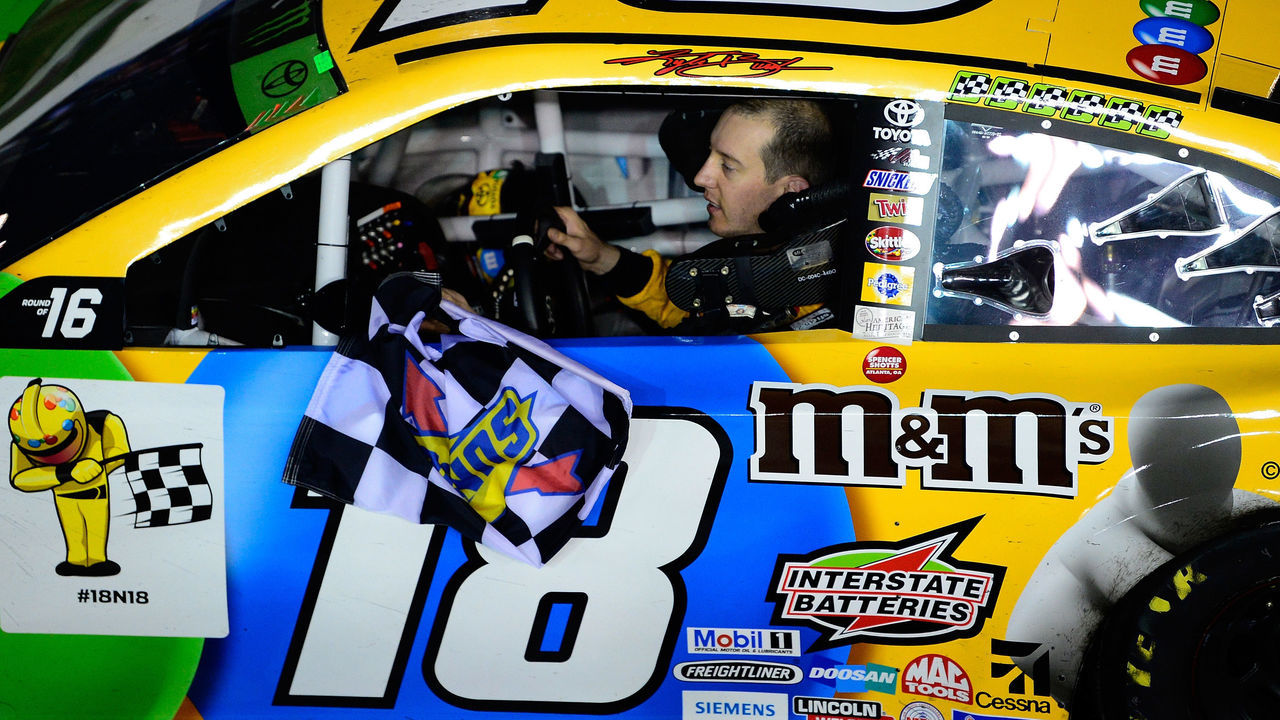 RICHMOND, VA - SEPTEMBER 22: Kyle Busch, driver of the #18 M&M's Toyota, celebrates after winning the Monster Energy NASCAR Cup Series Federated Auto Parts 400 at Richmond Raceway on September 22, 2018 in Richmond, Virginia.