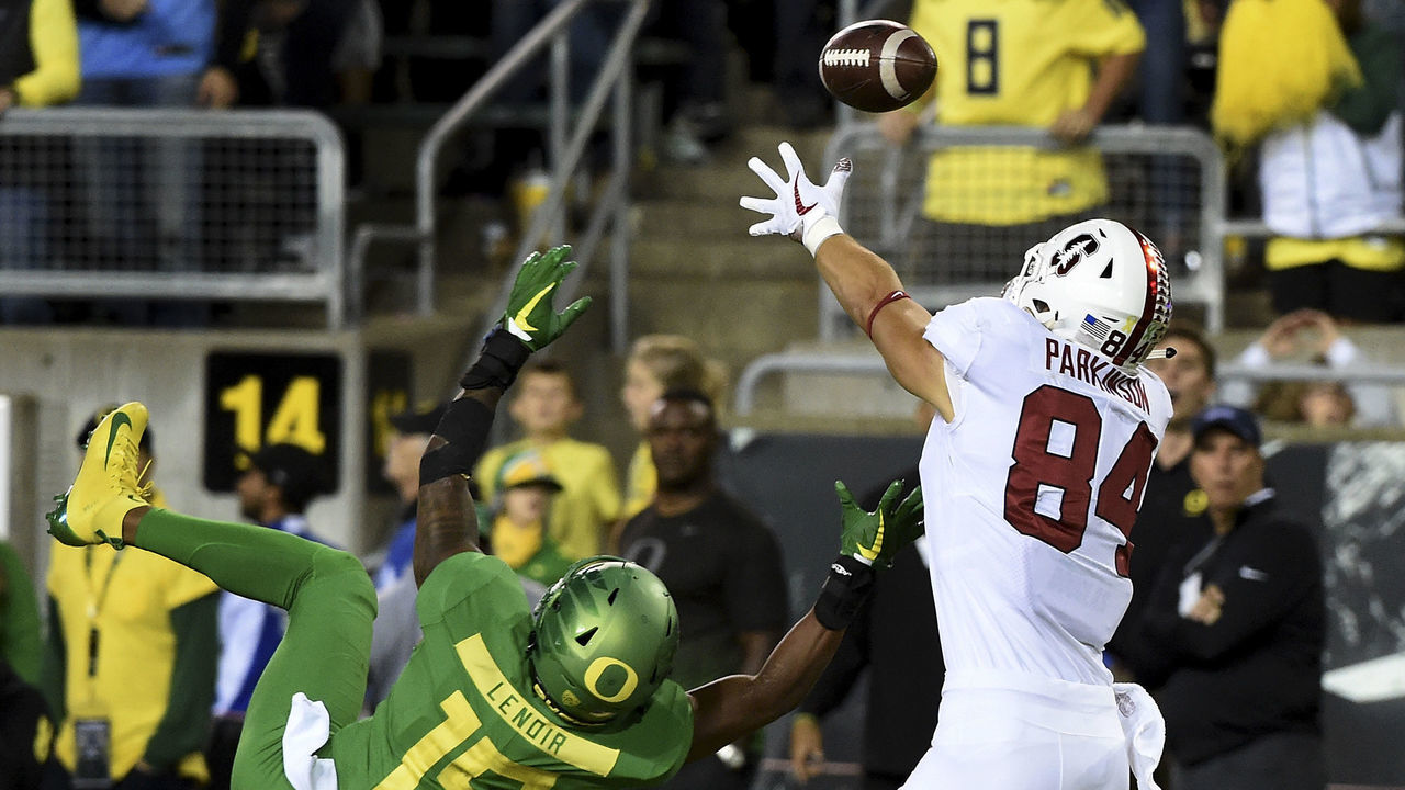 EUGENE, OR - SEPTEMBER 22: Tight end Colby Parkinson (84) of the Stanford Cardinal catches a touchdown pass over cornerback Deommodore Lenoir #15 of the Oregon Ducks in during overtime of the game at Autzen Stadium on September 22, 2018 in Eugene, Oregon. Stanford won the game 38-31.