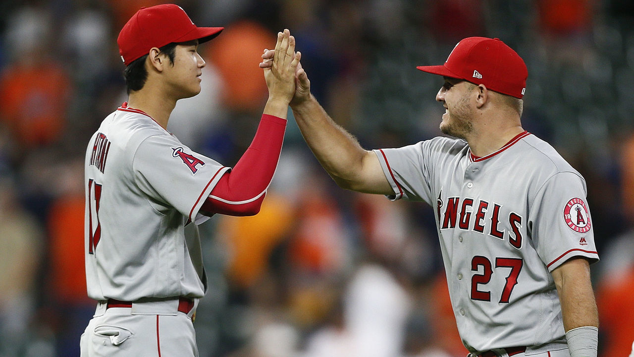 HOUSTON, TX - AUGUST 31: Mike Trout #27 of the Los Angeles Angels of Anaheim high fives Shohei Ohtani #17 after a 3-0 win over the Houston Astros at Minute Maid Park on August 31, 2018 in Houston, Texas.