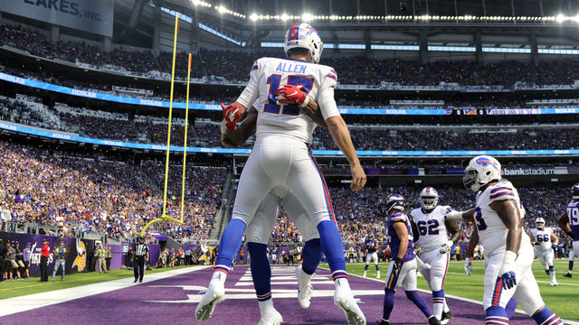 MINNEAPOLIS, MN - SEPTEMBER 23: Josh Allen #17 of the Buffalo Bills celebrates with teammates after scoring a touchdown in the first quarter of the game against the Minnesota Vikings at U.S. Bank Stadium on September 23, 2018 in Minneapolis, Minnesota.
