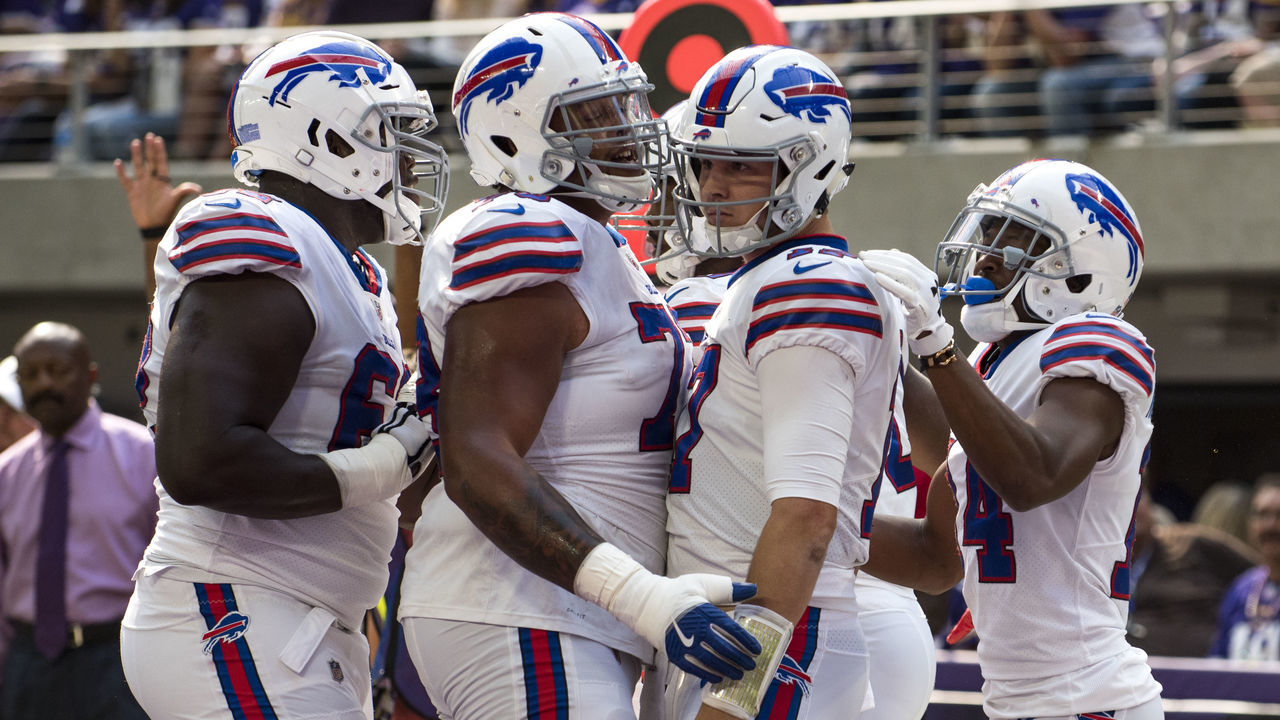 MINNEAPOLIS, MN - SEPTEMBER 23: Josh Allen #17 of the Buffalo Bills celebrates with teammates after scoring a touchdown in the first quarter of the game against the Minnesota Vikings at U.S. Bank Stadium on September 23, 2018 in Minneapolis, Minnesota.