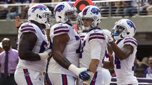 MINNEAPOLIS, MN - SEPTEMBER 23: Josh Allen #17 of the Buffalo Bills celebrates with teammates after scoring a touchdown in the first quarter of the game against the Minnesota Vikings at U.S. Bank Stadium on September 23, 2018 in Minneapolis, Minnesota.