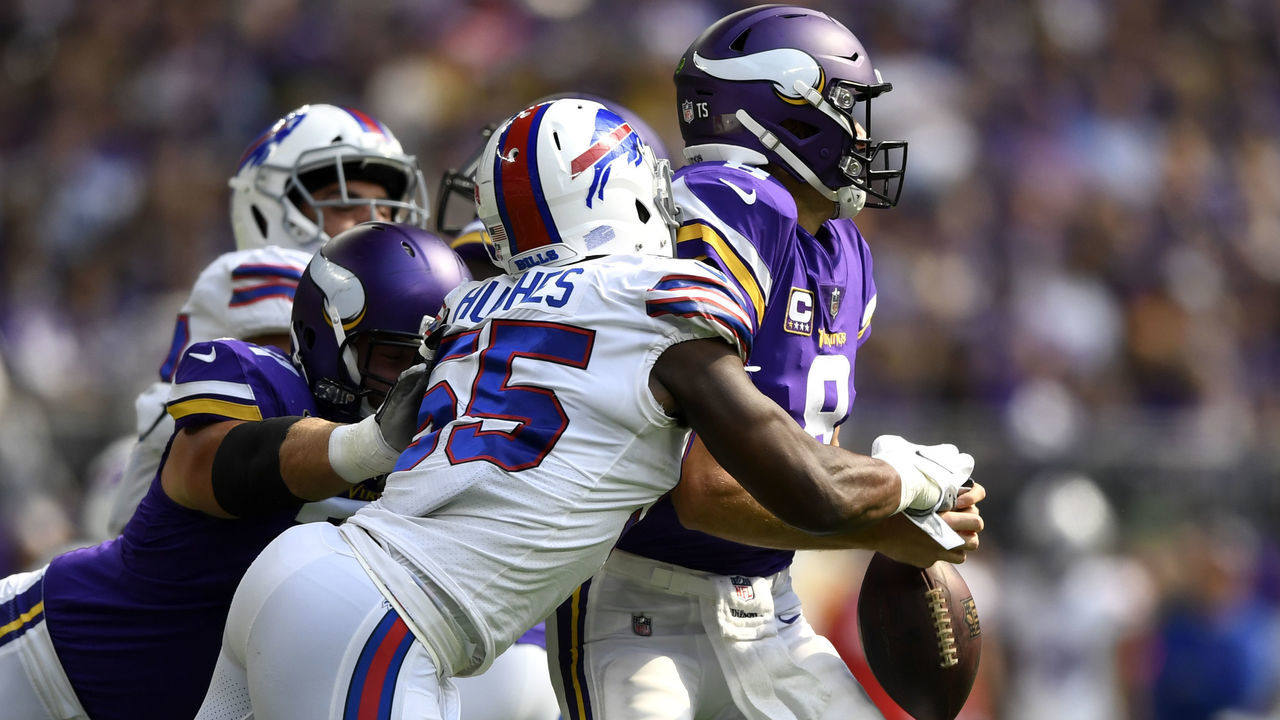 MINNEAPOLIS, MN - SEPTEMBER 23: Jerry Hughes #55 of the Buffalo Bills strips the ball out of the hands of Kirk Cousins #8 of the Minnesota Vikings in the first quarter of the game at U.S. Bank Stadium on September 23, 2018 in Minneapolis, Minnesota.