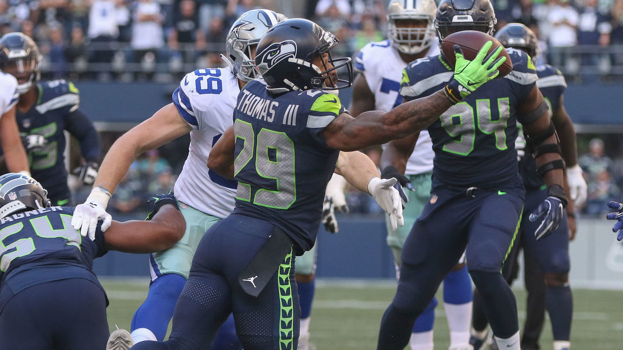 SEATTLE, WA - SEPTEMBER 23: Free safety Earl Thomas #29 of the Seattle Seahawks intercepts a pass against tight end Blake Jarwin #89 of the Dallas Cowboys in the fourth quarter at CenturyLink Field on September 23, 2018 in Seattle, Washington.