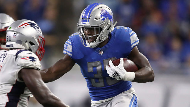 DETROIT, MI - SEPTEMBER 23: Kerryon Johnson #33 of the Detroit Lions looks to gain yardage against the New England Patriots during the first half at Ford Field on September 23, 2018 in Detroit, Michigan.