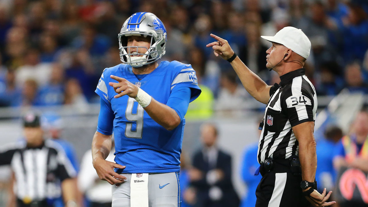 DETROIT, MI - SEPTEMBER 23: Referee Clete Blakeman #34 makes a call as Matthew Stafford #9 of the Detroit Lions reacts during the first quarter against the New England Patriots at Ford Field on September 23, 2018 in Detroit, Michigan.