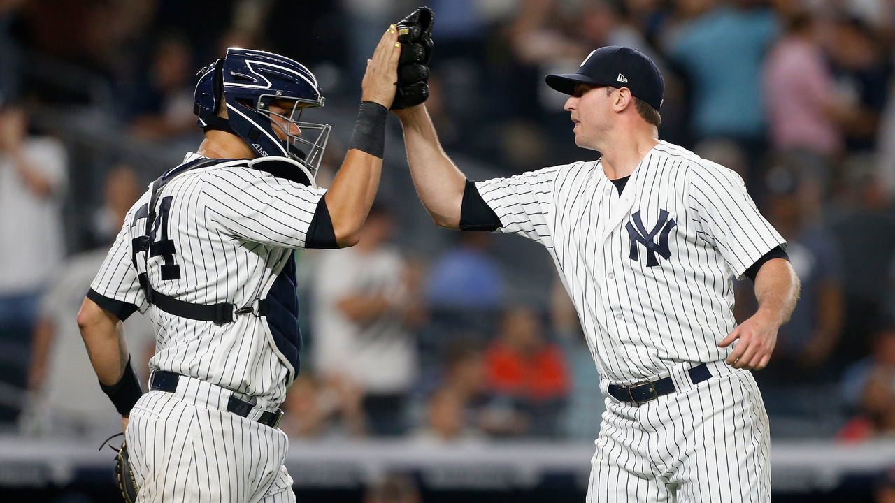 NEW YORK, NY - SEPTEMBER 18: Zach Britton #53 and Gary Sanchez #24 of the New York Yankees celebrate after defeating the Boston Red Sox at Yankee Stadium on September 18, 2018 in the Bronx borough of New York City.