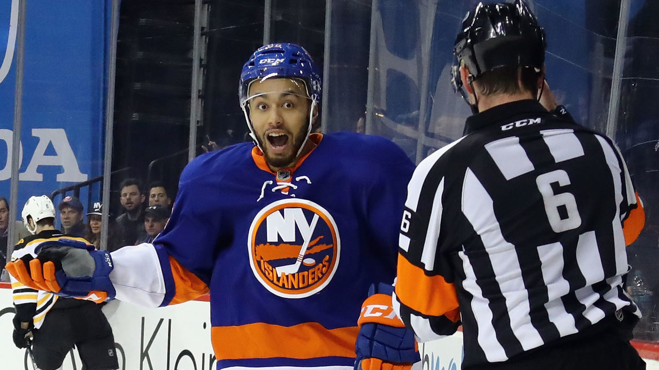 NEW YORK, NY - MARCH 25: Joshua Ho-Sang #66 of the New York Islanders argues a high sticking penalty against the Boston Bruins with referee Francis Charron #6 at the Barclays Center on March 25, 2017 in the Brooklyn borough of New York City.
