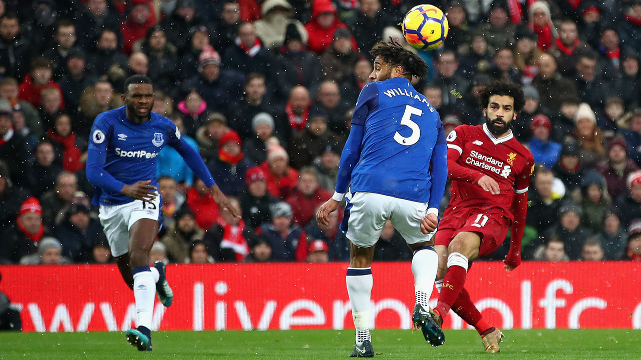 LIVERPOOL, ENGLAND - DECEMBER 10: Mohamed Salah of Liverpool scores the first Liverpool goal during the Premier League match between Liverpool and Everton at Anfield on December 10, 2017 in Liverpool, England.