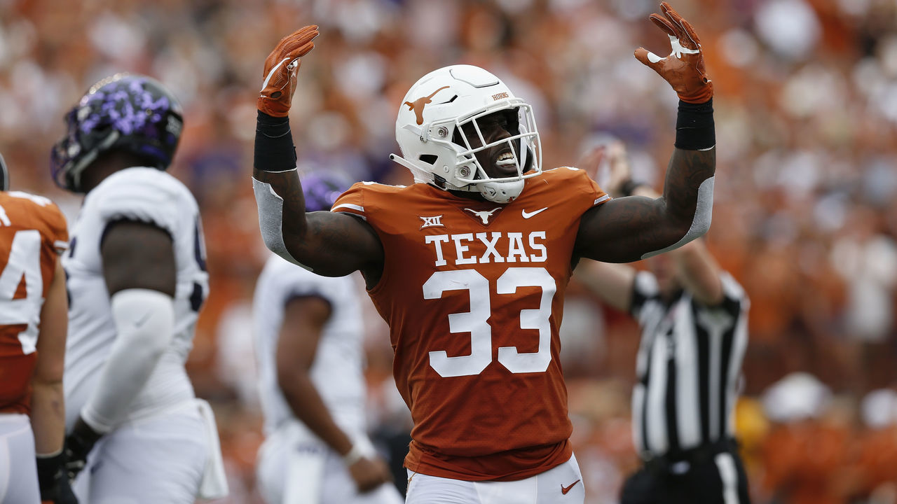 AUSTIN, TX - SEPTEMBER 22: Gary Johnson #33 of the Texas Longhorns celebrates after a tackle in the first half against the TCU Horned Frogs at Darrell K Royal-Texas Memorial Stadium on September 22, 2018 in Austin, Texas.