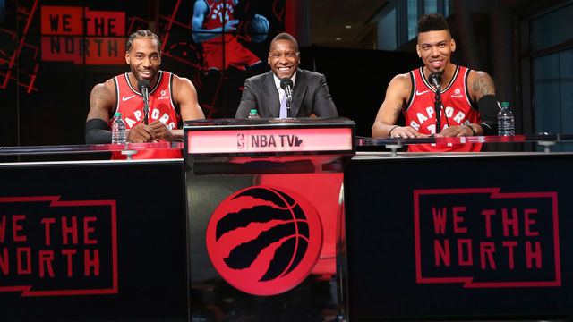 TORONTO, ON- SEPTEMBER 24 - Masai Ujiri is flanked by the new Toronto Raptors Kawhi Leonard (2) and Danny Green (14) as they take questions as the Toronto Raptors host their media day before going to Vancouver for their training camp. Media Day was held at the Scotiabank Arena in Toronto. September 24, 2018. (Steve Russell/Toronto Star via Getty Images)