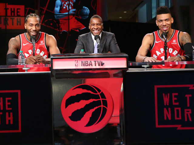 TORONTO, ON- SEPTEMBER 24 - Masai Ujiri is flanked by the new Toronto Raptors Kawhi Leonard (2) and Danny Green (14) as they take questions as the Toronto Raptors host their media day before going to Vancouver for their training camp. Media Day was held at the Scotiabank Arena in Toronto. September 24, 2018. (Steve Russell/Toronto Star via Getty Images)