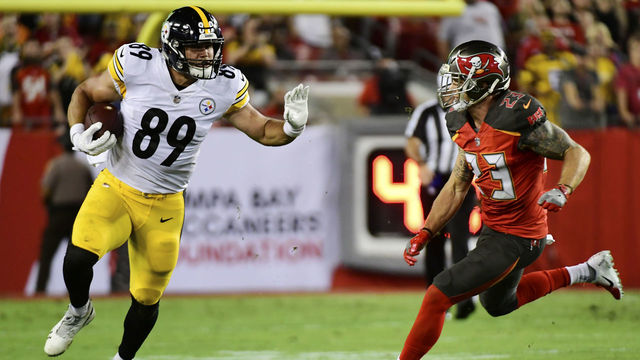 TAMPA, FL - SEPTEMBER 24: Vance McDonald #89 of the Pittsburgh Steelers takes on Chris Conte #23 of the Tampa Bay Buccaneers in the first quarter on September 24, 2018 at Raymond James Stadium in Tampa, Florida.