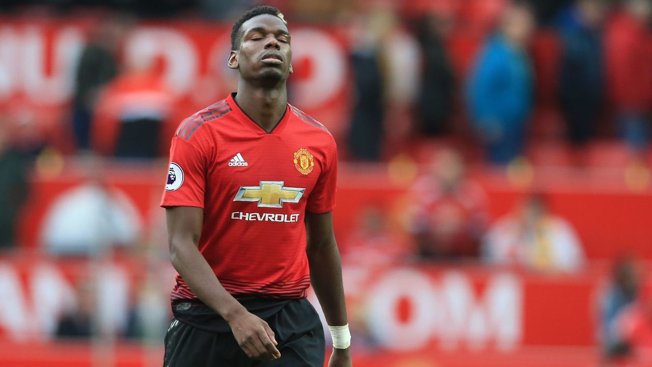 Manchester United's French midfielder Paul Pogba reacts as he leaves the pitch after the English Premier League football match between Manchester United and Wolverhampton Wanderers at Old Trafford in Manchester, north west England, on September 22, 2018. - The game finished 1-1.