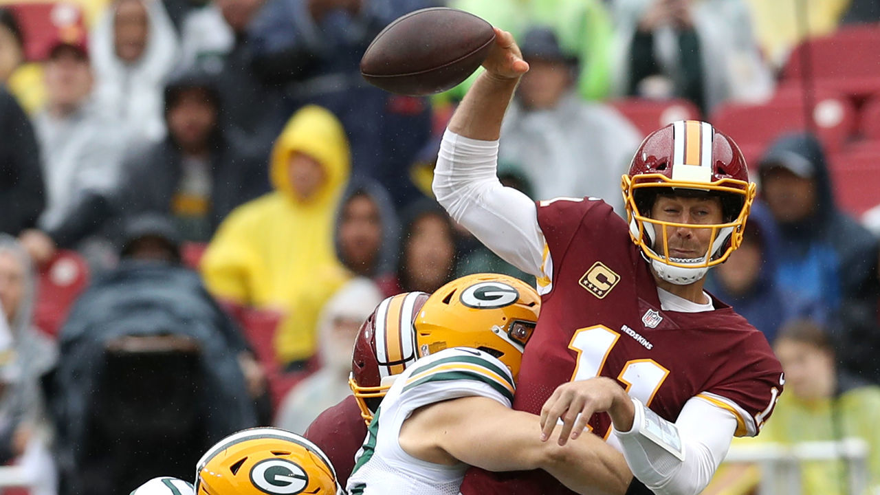 LANDOVER, MD - SEPTEMBER 23: Clay Matthews #52 of the Green Bay Packers hits quarterback Alex Smith #11 of the Washington Redskins in the first half at FedExField on September 23, 2018 in Landover, Maryland.