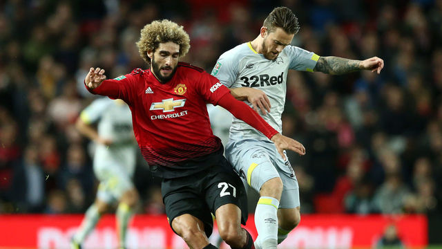 MANCHESTER, ENGLAND - SEPTEMBER 25: Marouane Fellaini of Manchester United is challenged by Jack Marriott of Derby County during the Carabao Cup Third Round match between Manchester United and Derby County at Old Trafford on September 25, 2018 in Manchester, England.