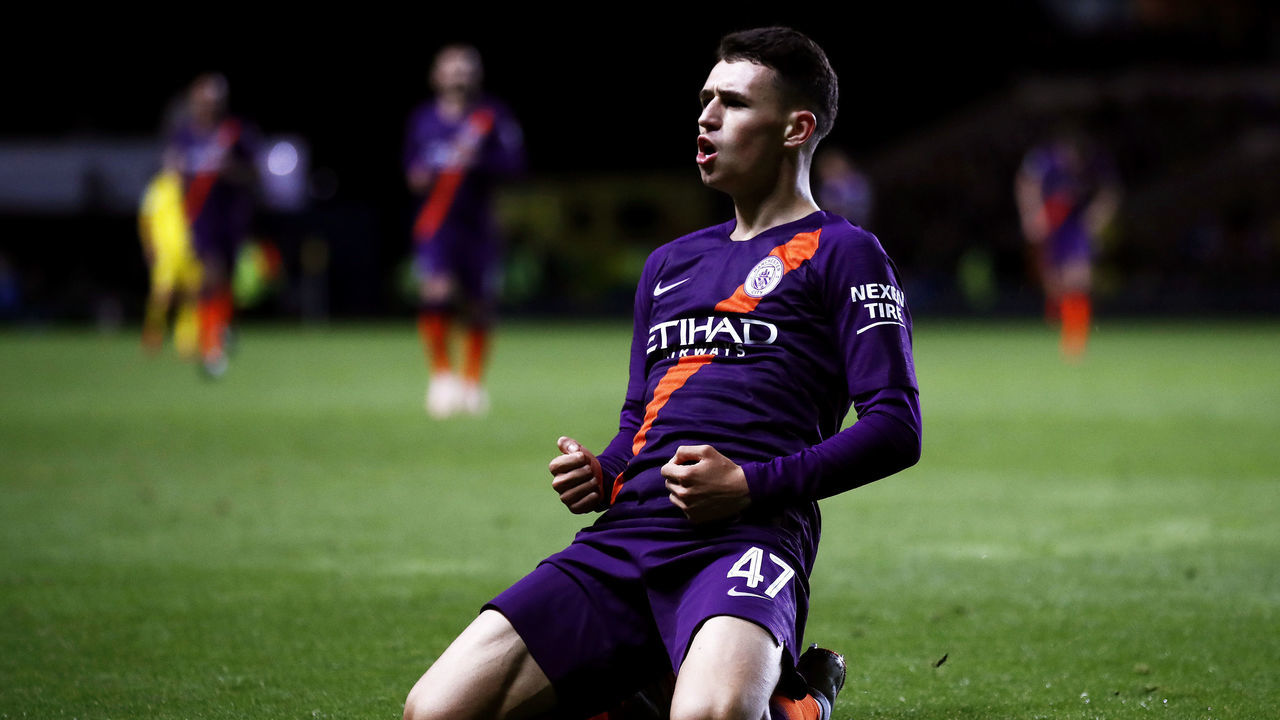 OXFORD, ENGLAND - SEPTEMBER 25: Phil Foden of Manchester City celebrates after scoring his team's third goal during the Carabao Cup Third Round match between Oxford United and Manchester City at Kassam Stadium on September 25, 2018 in Oxford, England.