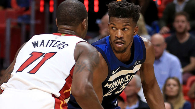 MIAMI, FL - OCTOBER 30: Jimmy Butler #23 of the Minnesota Timberwolves drives on Dion Waiters #11 of the Miami Heat during a game at American Airlines Arena on October 30, 2017 in Miami, Florida.