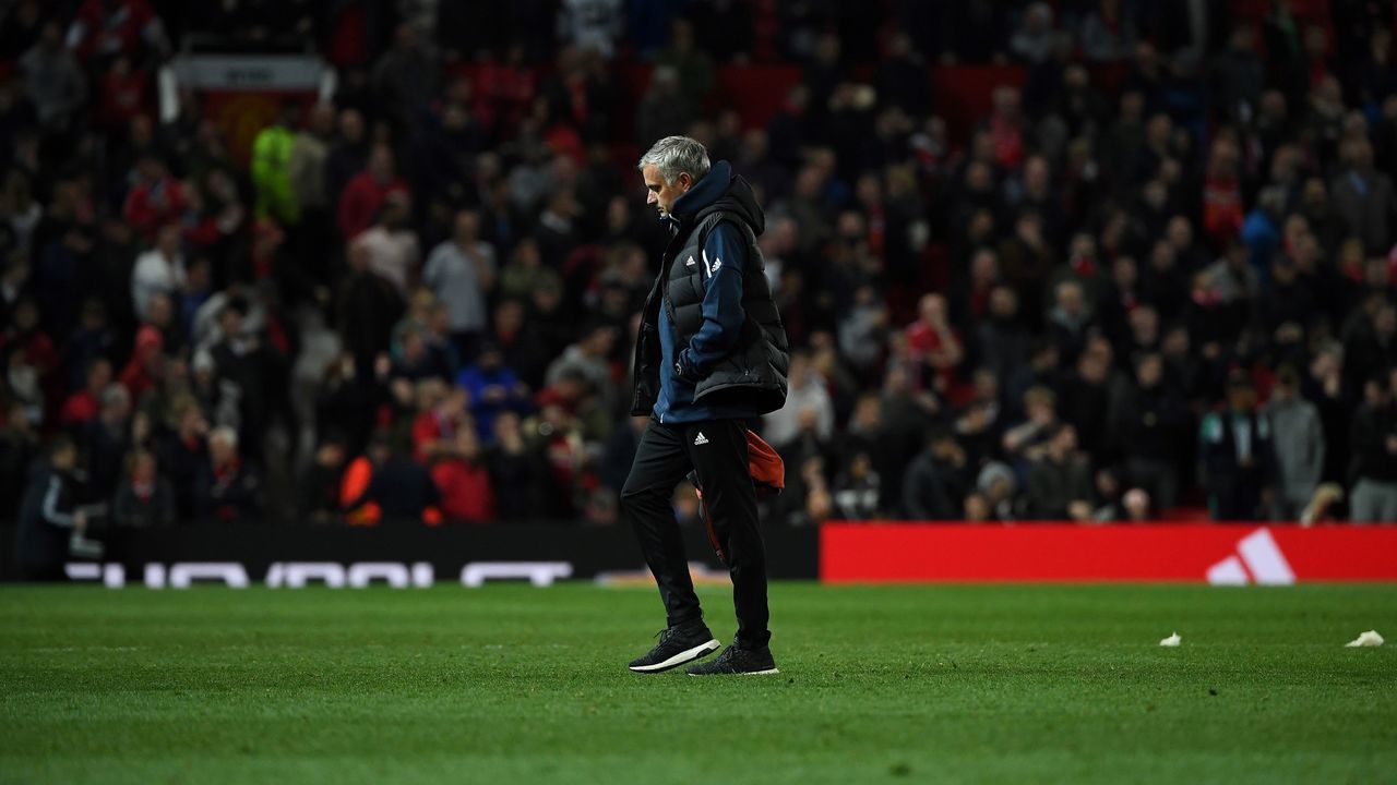 TOPSHOT - Manchester United's Portuguese manager Jose Mourinho leaves teh pitch following the English League Cup third round football match between Manchester United and Derby County at Old Trafford in Manchester, north west England, on September 25, 2018. - Derby won 8-7 on penalties.
