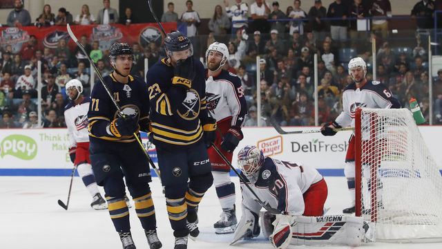 CLINTON, NY - SEPTEMBER 25: Sam Reinhart #23 of the Buffalo Sabres celebrates with Evan Rodrigues #71 after scoring a second period goal against the Columbus Blue Jackets during a preseason game during the NHL Kraft Hockeyville USA at Clinton Arena on September 25, 2018 in Clinton, New York.