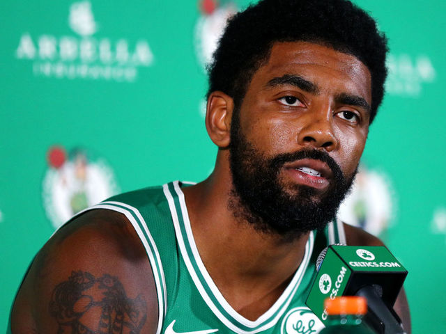 CANTON, MA - SEPTEMBER 24: Kyrie Irving #11 answers questions during a press conference on Boston Celtics Media Day on September 24, 2018 in Canton, Massachusetts. NOTE TO USER: User expressly acknowledges and agrees that, by downloading and/or using this photograph, user is consenting to the terms and conditions of the Getty Images License Agreement.