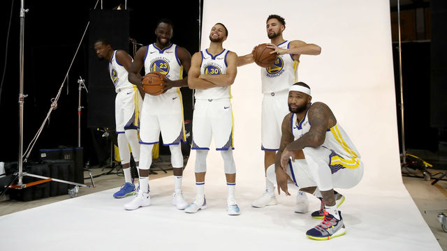 OAKLAND, CA - SEPTEMBER 24: (L-R) Kevin Durant #35, Draymond Green #23, Stephen Curry #30, Klay Thompson #11, and DeMarcus Cousins #0 of the Golden State Warriors pose for a group picture during the Golden State Warriors media day on September 24, 2018 in Oakland, California.