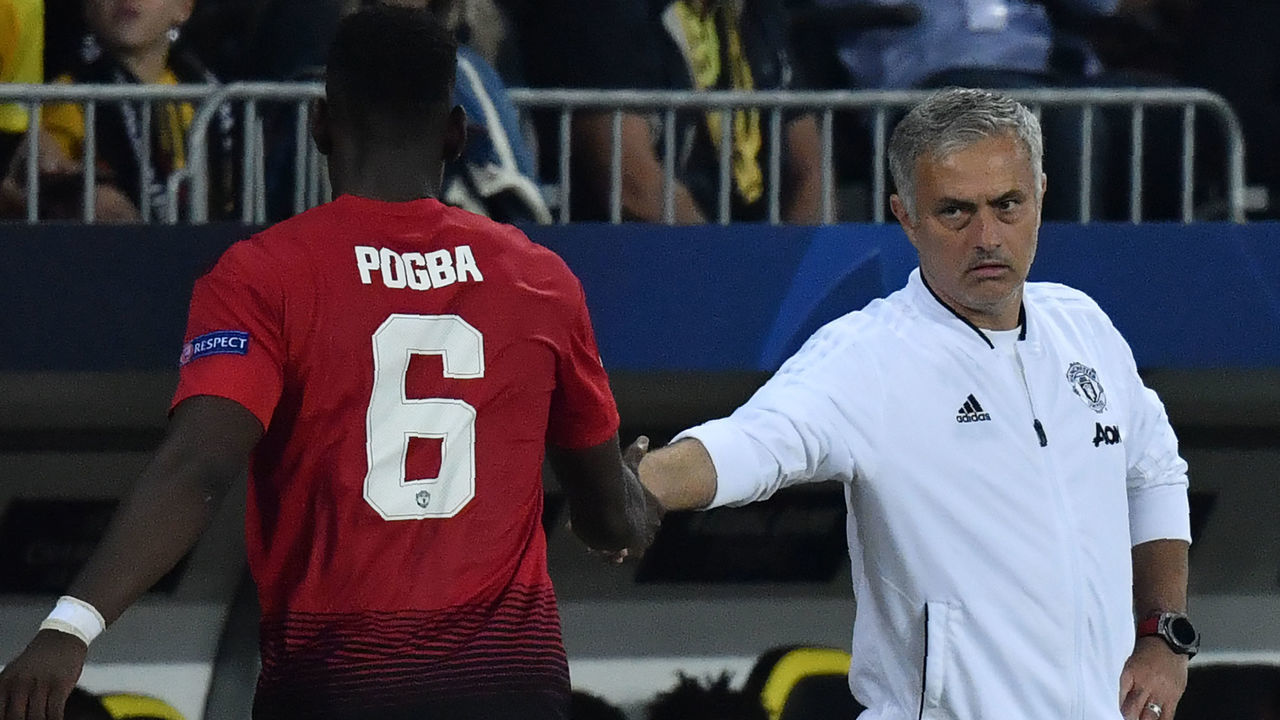 Manchester United's French midfielder Paul Pogba (L) shakes hands with Manchester United's Portuguese manager Jose Mourinho after his substitution during the UEFA Champions League group H football match between Young Boys and Manchester United at The Stade de Suisse in Bern on September 19, 2018.