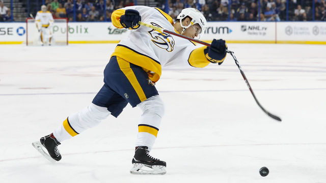 TAMPA, FL - SEPTEMBER 22: Nashville Predators right wing Eeli Tolvanen (11) breaks his stick attempting to take a shot in the first period of the NHL preseason game between the Nashville Predators and Tampa Bay Lightning on September 22, 2018, at Amalie Arena in Tampa, FL.