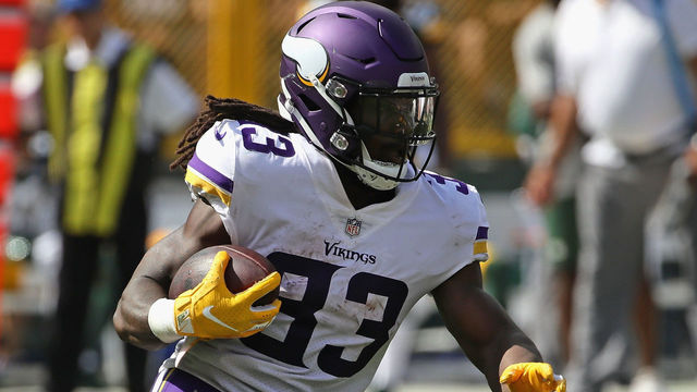 GREEN BAY, WI - SEPTEMBER 16: Dalvin Cook #33 of the Minnesota Vikings runs against the Green Bay Packers at Lambeau Field on September 16, 2018 in Green Bay, Wisconsin. The Vikings and the Packers tied 29-29 after overtime.