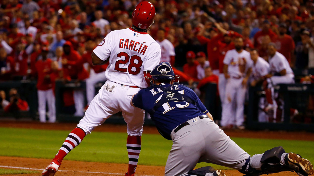 ST. LOUIS, MO - SEPTEMBER 26: Adolis Garcia #28 of the St. Louis Cardinals is tagged out at home plate by Erik Kratz #15 of the Milwaukee Brewers in the eighth inning at Busch Stadium on September 26, 2018 in St. Louis, Missouri.