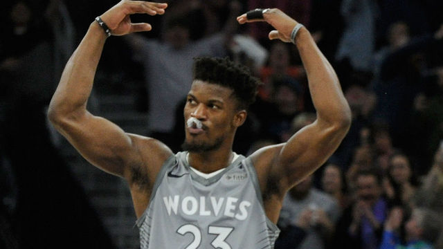 MINNEAPOLIS, MN - APRIL 11: Jimmy Butler #23 and Karl-Anthony Towns #32 of the Minnesota Timberwolves celebrate in the final minute of overtime of the game against the Denver Nuggets on April 11, 2018 at the Target Center in Minneapolis, Minnesota. The Timberwolves defeated the Nuggets 112-106.