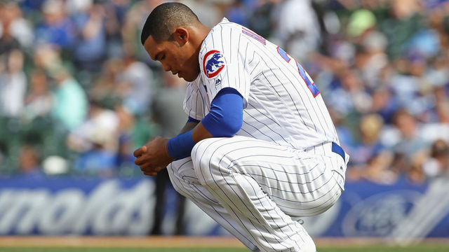 CHICAGO, IL - MAY 02: Addison Russell #27 of the Chicago Cubs waits as the grounds crew grooms the infield after striking out in the 7th inning against the Colorado Rockies at Wrigley Field on May 2, 2018 in Chicago, Illinois.