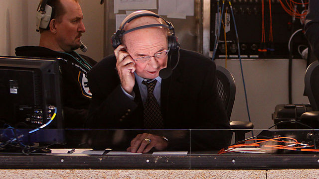 WINNIPEG, CANADA - JANUARY 21: Hockey Night in Canada and Hockey Hall of Fame broadcaster Bob Cole (left) calls the game with color commentator Garry Galley (right) during first period action between the Florida Panthers and the Winnipeg Jets at the MTS Centre on January 21, 2012 in Winnipeg, Manitoba, Canada.
