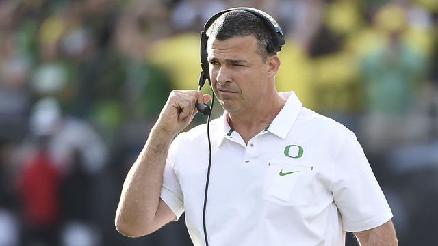 EUGENE, OR - SEPTEMBER 22: Head coach Mario Cristobal of the Oregon Ducks greets his players as they come off the field after scoring a touchdown during the first quarter of the game against the Stanford Cardinal at Autzen Stadium on September 22, 2018 in E
