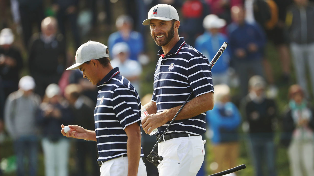 PARIS, FRANCE - SEPTEMBER 28: Rickie Fowler of the United States and Dustin Johnson of the United States celebrate during the morning fourball matches of the 2018 Ryder Cup at Le Golf National on September 28, 2018 in Paris, France.