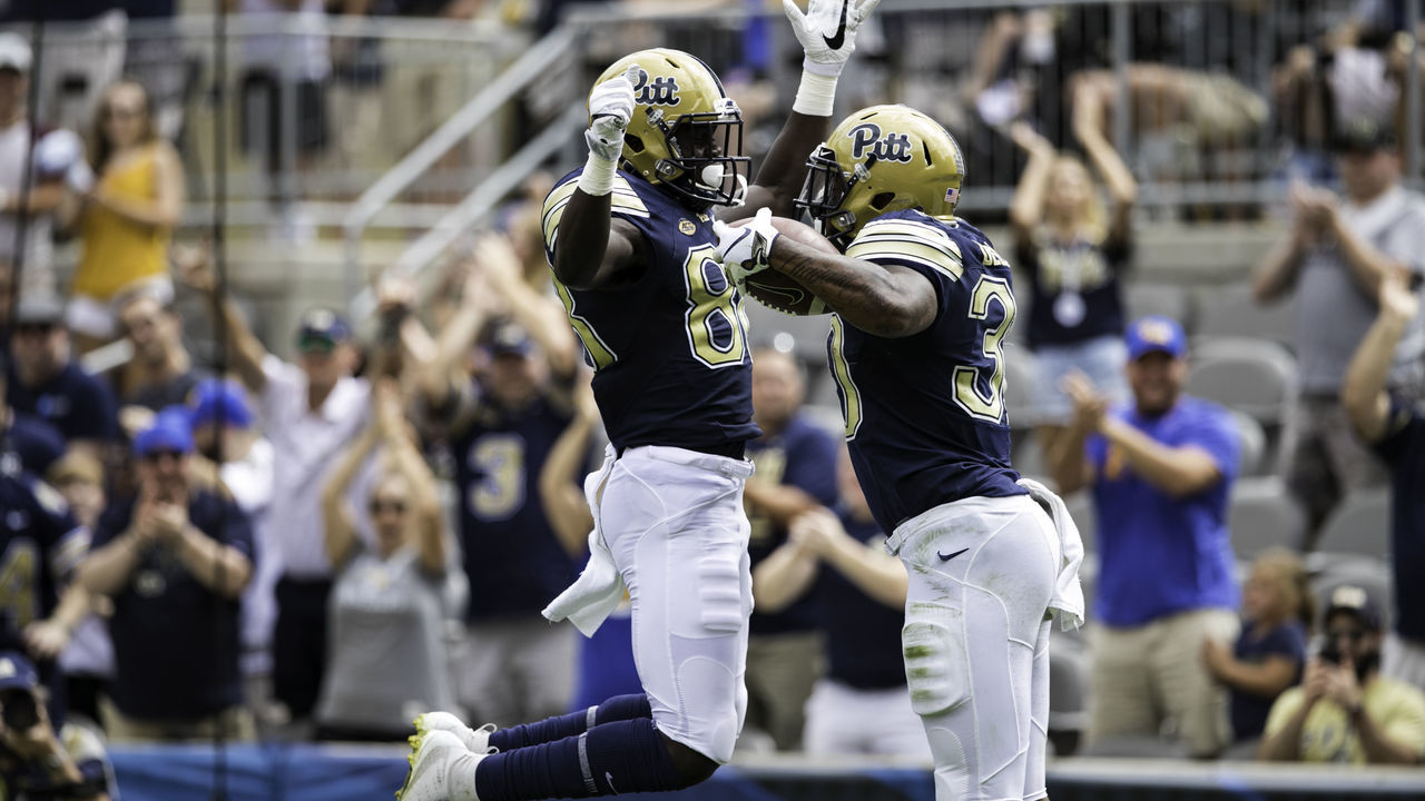 PITTSBURGH, PA - SEPTEMBER 15: Pittsburgh Panthers running back Qadree Ollison (30) and Pittsburgh Panthers wide receiver Dontavius Butler-Jenkins (88) celebrate after a touchdown run during the college football game between the Georgia Tech Yellow Jackets and Pittsburgh Panthers on September 15, 2018 at Heinz Field in Pittsburgh PA.
