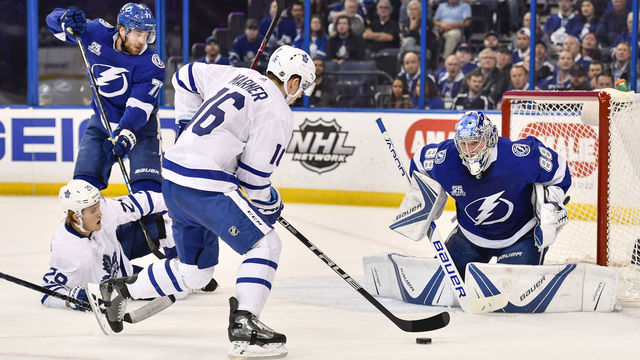 TAMPA, FL - MARCH 20: Toronto Maple Leafs center Mitchell Marner (16) skates in on Tampa Bay Lightning goalie Andrei Vasilevsky (88) during the first period of an NHL game between the Toronto Maple Leafs and the Tampa Bay Lightning on March 20, 2018, at Amalie Arena in Tampa, FL.