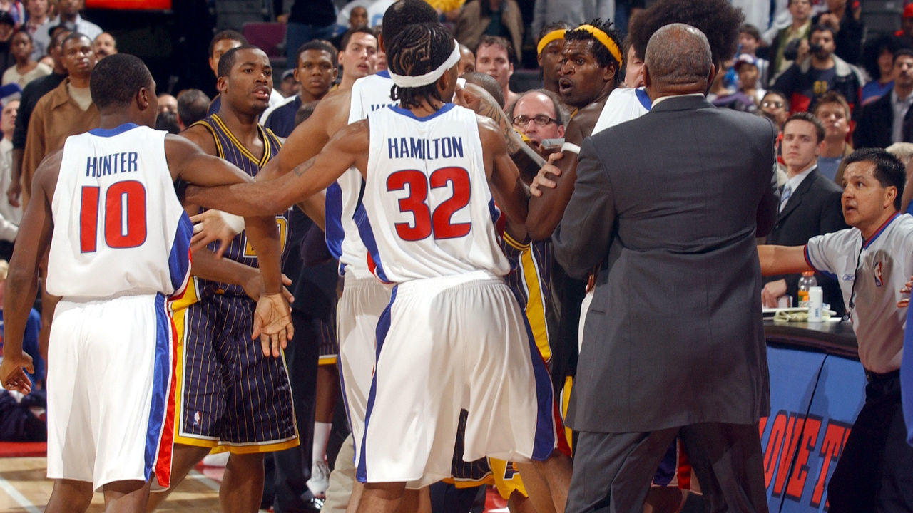 AUBURN HILLS, MI - NOVEMBER 19: Jermaine O'Neal #7 (yellow headband) and other members of the Indiana Pacers scuffle with members of the Detroit Pistons during a melee involving fans at a game against the Detroit Pistons November 19, 2004 at the Palace of Auburn Hills, in Auburn Hills, Michigan. NOTE TO USER: User expressly acknowledges and agrees that, by downloading and/or using this Photograph, user is consenting to the terms and conditions of the Getty Images License Agreement. Mandatory Copyright Notice: Copyright 2004 NBAE